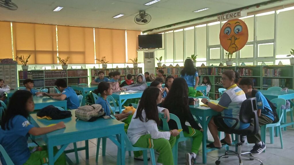 Junior High Students Engage in Collaborative Learning at the School Library